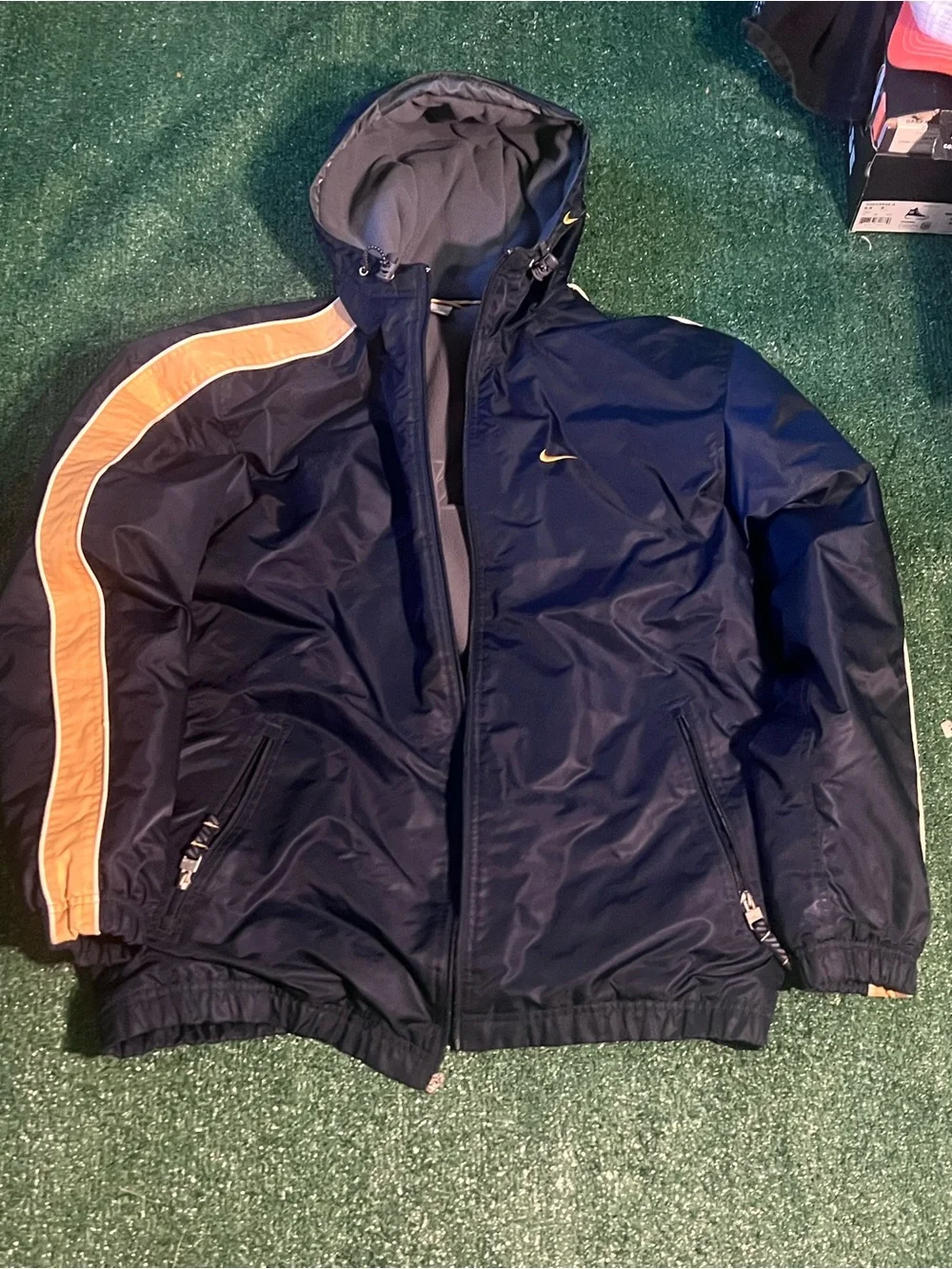 Nike Men’s Navy Windbreaker Jacket with Gold Stripe Accents